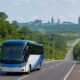 Bus antarmoda menuju IKN melintas di jalan hijau Kalimantan Timur